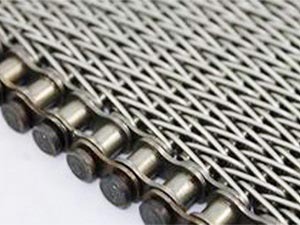 Compound weave conveyor belt with chain edge